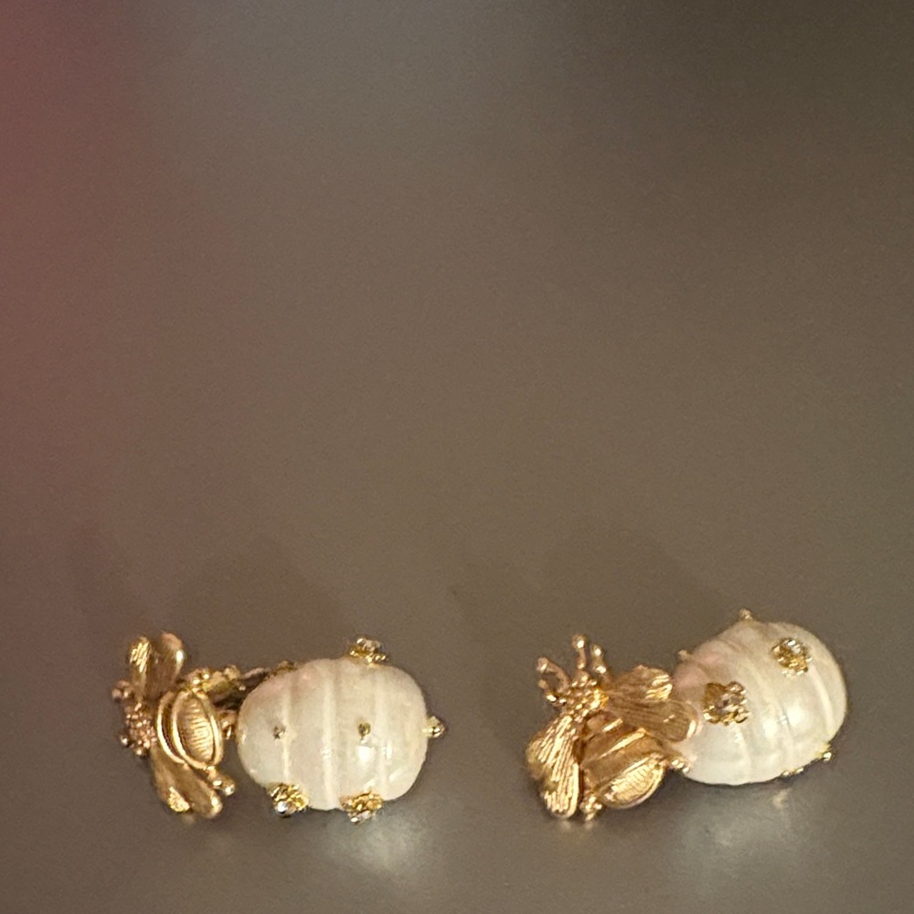 14 karat gold plated earrings with mother of pearl  and bee accent